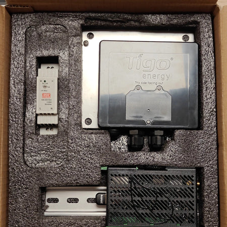 Tigo CCA kit 344-00000-00 in its open box: Mean Well DR-15-24 DIN rail power supply, Tigo TAP gateway 150-00000-50, DIN rail and CCA 336-20000-00.