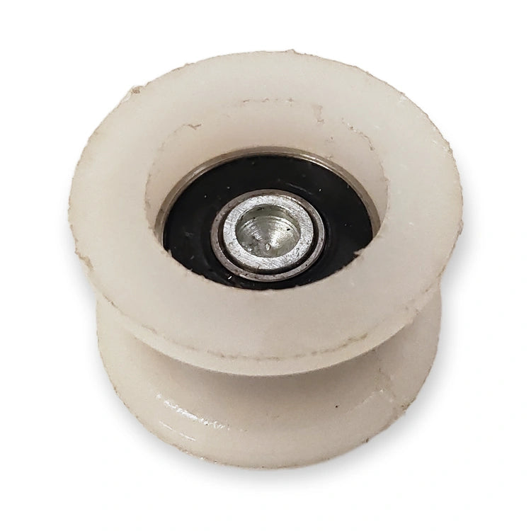 Schindler Varidor 30 upthrust counter roller 34 mm, bearing side on white background.