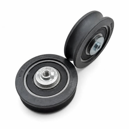 Two Sematic C144AANP hanger rollers Ø60/53 × 18 mm with M6 hardware, SKU C144AANP-3rd, shown in an alternate studio arrangement.