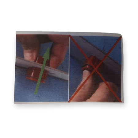 Instruction card for the LiftLogic KK35 stop button showing the correct pull direction with a green arrow and the incorrect grip crossed out in red.