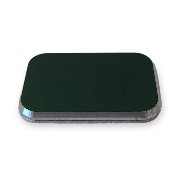 LiftLogic KK35 raised green aluminium button cap seen from the side showing the raised profile, on white background.
