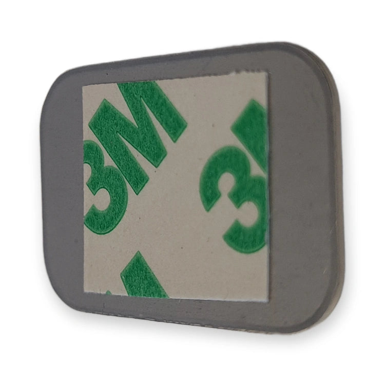 Back of LiftLogic KK35 stainless steel button cap with the 3M adhesive pad, on white background.