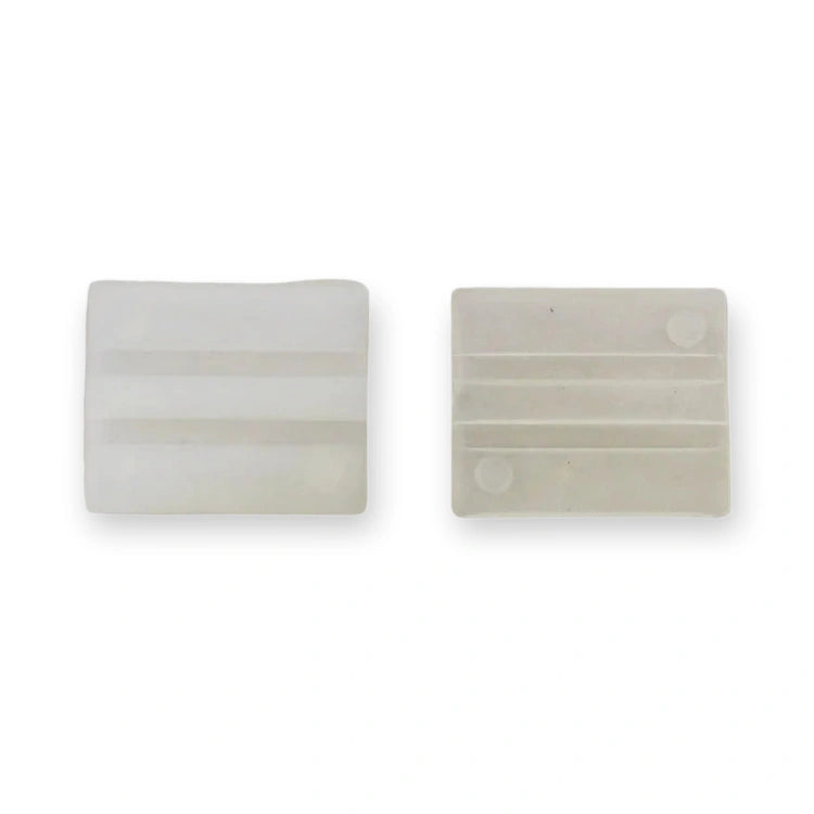 Kone Guide Shoe Insert 80x26x24 5mm KM652437G05 (KM652437G05-3rd), top-down view of two white pads with horizontal grooves and circular indentations, on white background.