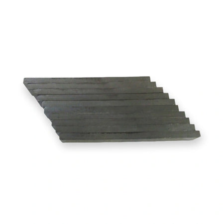 Kone Magnet Strip 120x15x6 mm LCE KM713228H01, stacked flat metal plates viewed from an angled side perspective, on white background.