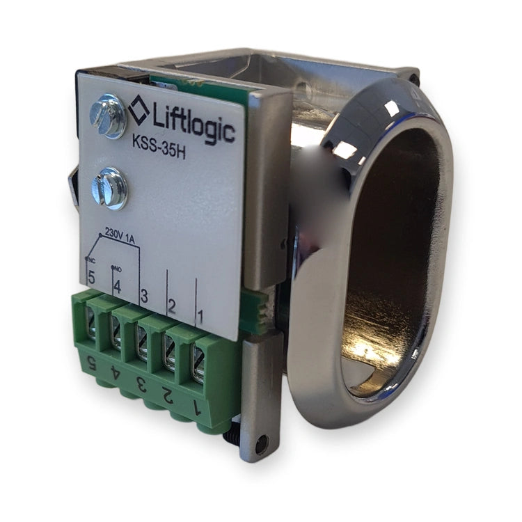 LiftLogic KSS-35H spring-loaded key switch for KK35 housing, label side with green screw terminals and chrome bezel, on white background.
